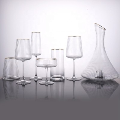 Luxury popular ribbed wine glass champagne tumbler high ball glass decanter with gold rim drinking set of 7